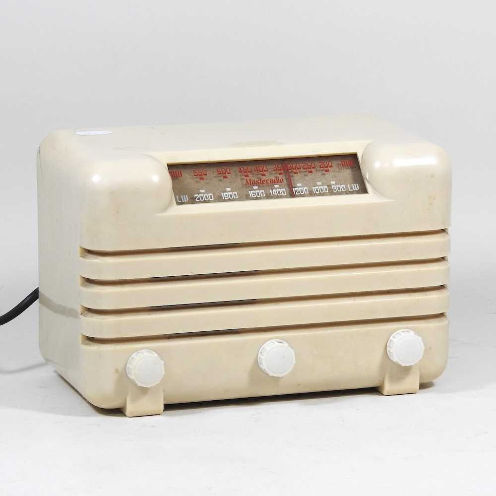 A 1930's Master Radio Ltd white bakelite cased radio, 26cm wide