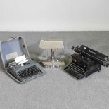 A vintage Imperial typewriter, together with another and a Universal money checker (3)