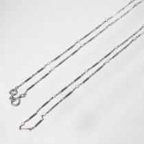 An unmarked platinum and seed pearl set guard chain, 20g, 150cm long