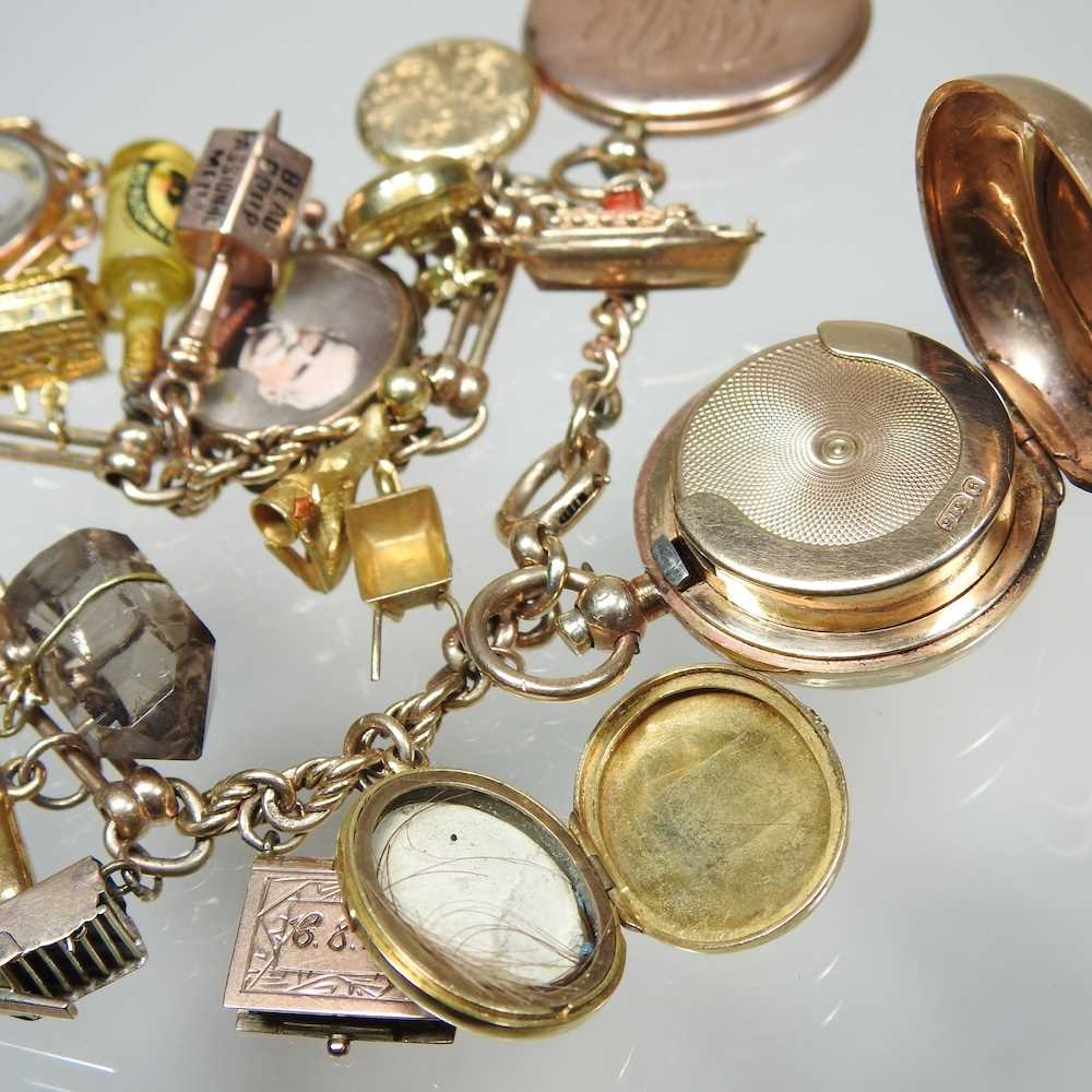 A gold charm bracelet, suspended with twenty-three various novelty charms, to include a sovereign - Image 12 of 12