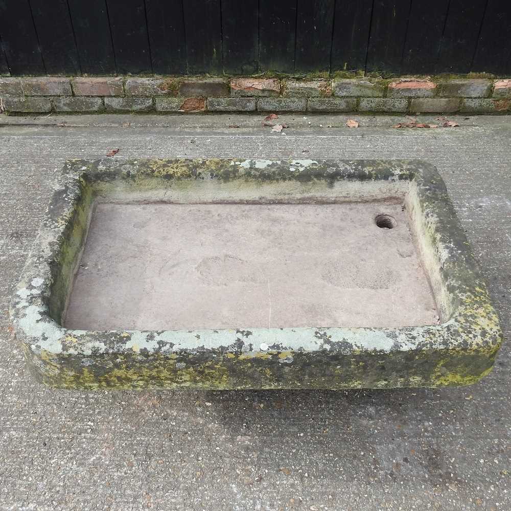 A large carved York stone sink, of shallow recangular shape 108w x 69d x 18h cm