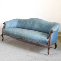 A 19th century carved mahogany and blue upholstered hump back show frame sofa, on cabriole legs 180w