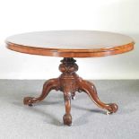 A Victorian burr walnut breakfast table, with a hinged oval top, on a quadruped base 136w x 102d x