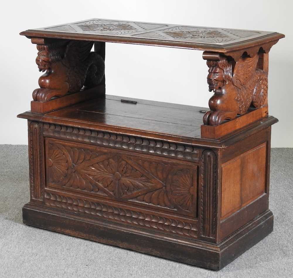 An early 20th century carved oak monk's bench, with griffin supports 92w x 50d x 82h cm - Image 2 of 10