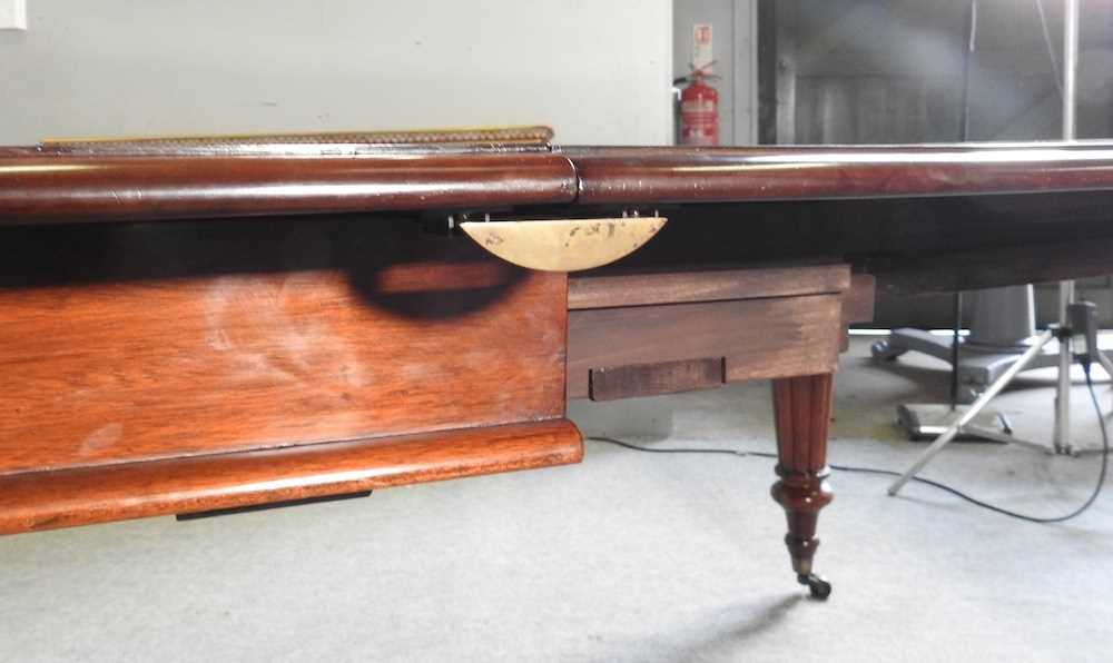 A Victorian style pull out extending dining table, 20th century, with four additional leaves, on - Image 5 of 5