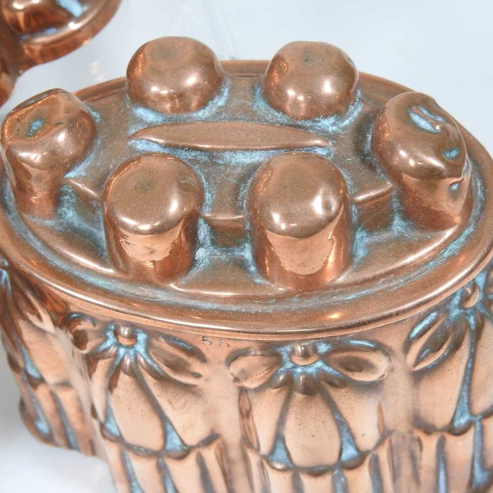 A Victorian copper jelly mould, stamped H. L. & Co, 12cm high, together with another similar and a - Image 4 of 8