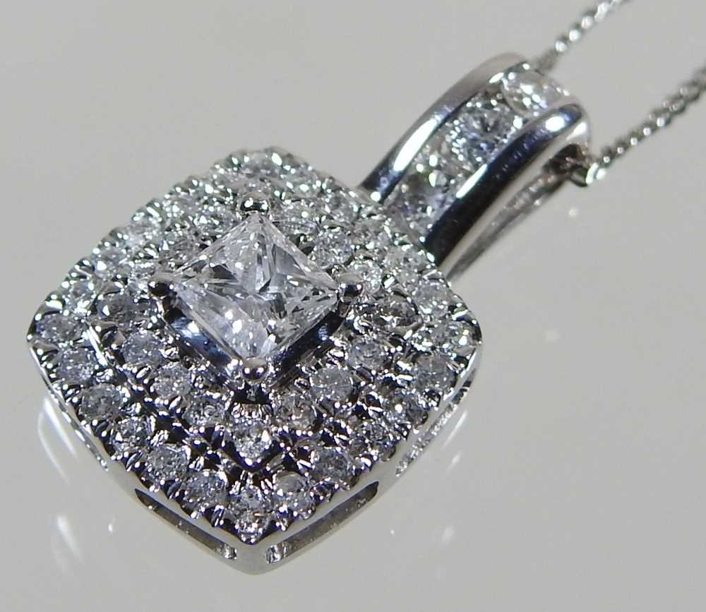 A 9 carat gold diamond cluster pendant, 9mm wide, on a fine chain, approximately 0.5 carats, 2.5g - Image 4 of 7