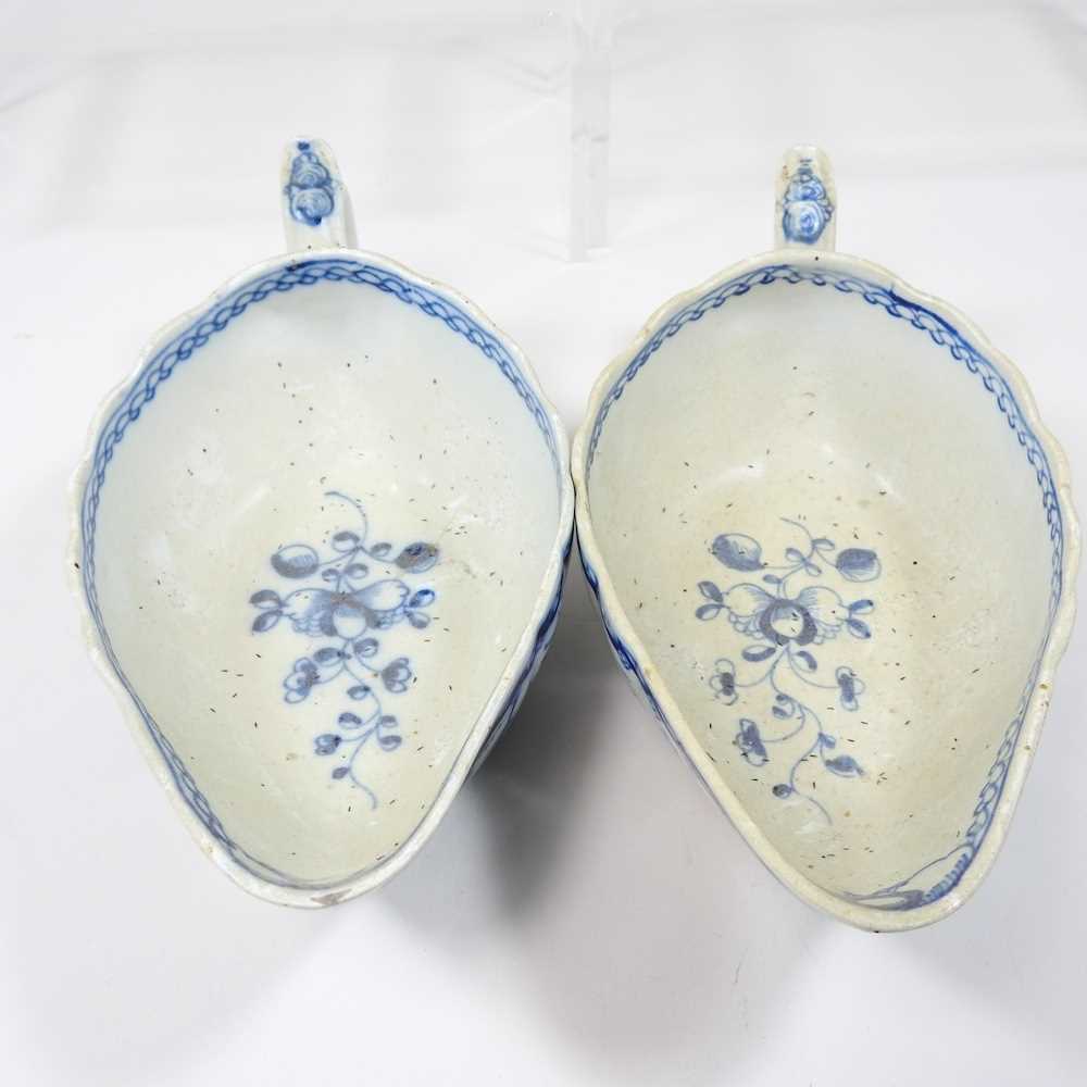 A pair of 18th century Staffordshire blue and white sauce boats, circa 1790, each painted with - Image 5 of 10