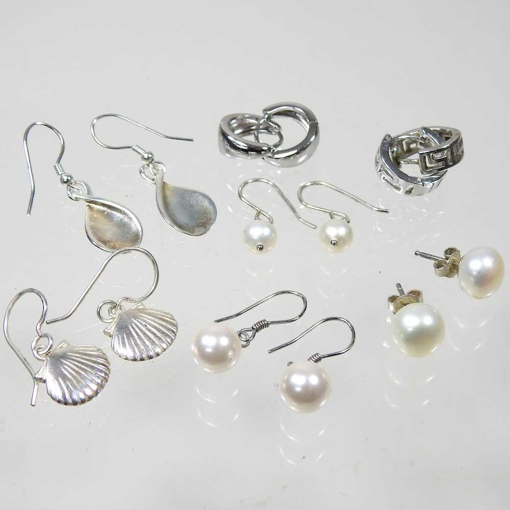 A pair of silver shell shaped pendant earrings, 2cm high, together with a collection of six pairs of