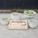 A stoneware sink, 64cm wide, together with four various cast stone garden pots (5)