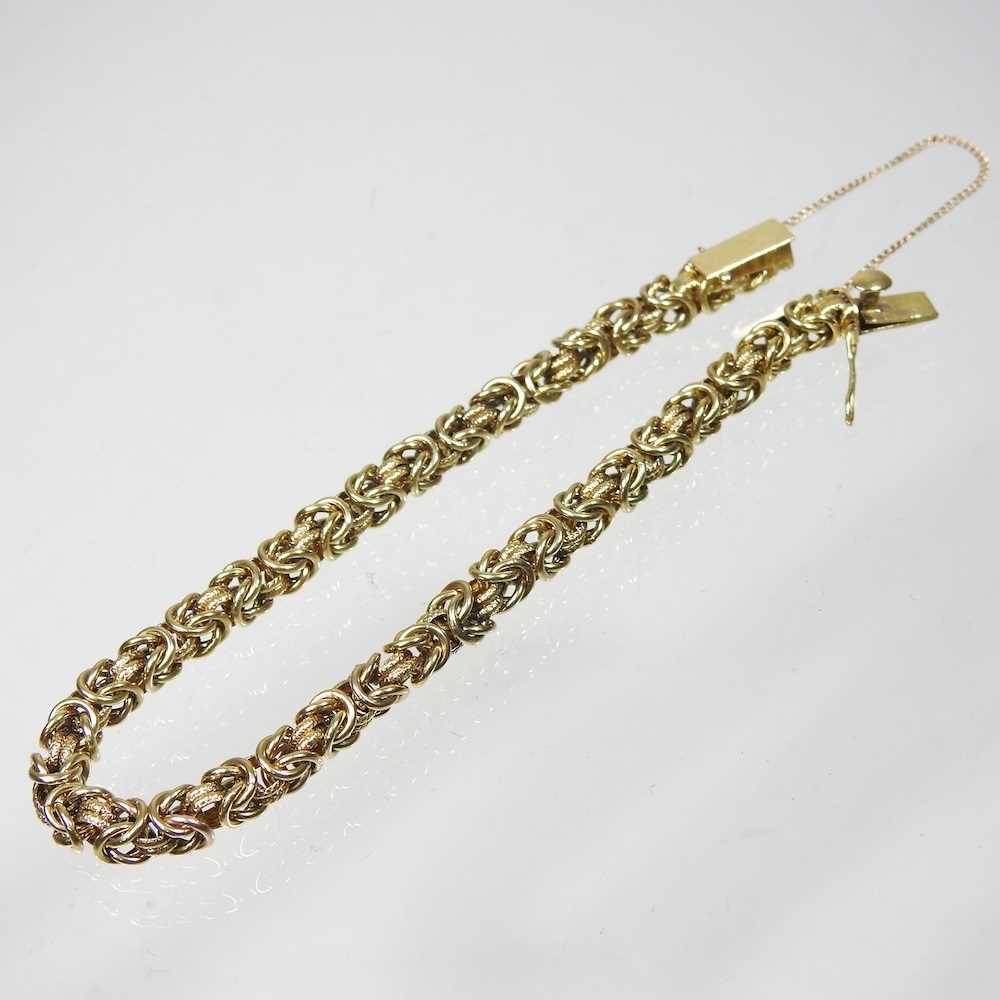 A 14 carat gold fancy link bracelet, the clasp with safety chain, stamped 585, 9g, 20cm long