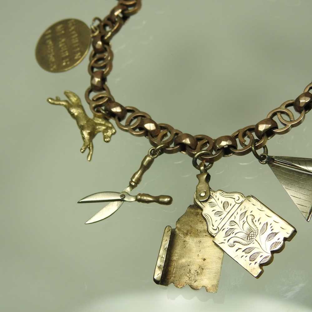 An early 20th century charm bracelet, suspended with a collection of twelve various novelty - Image 4 of 9