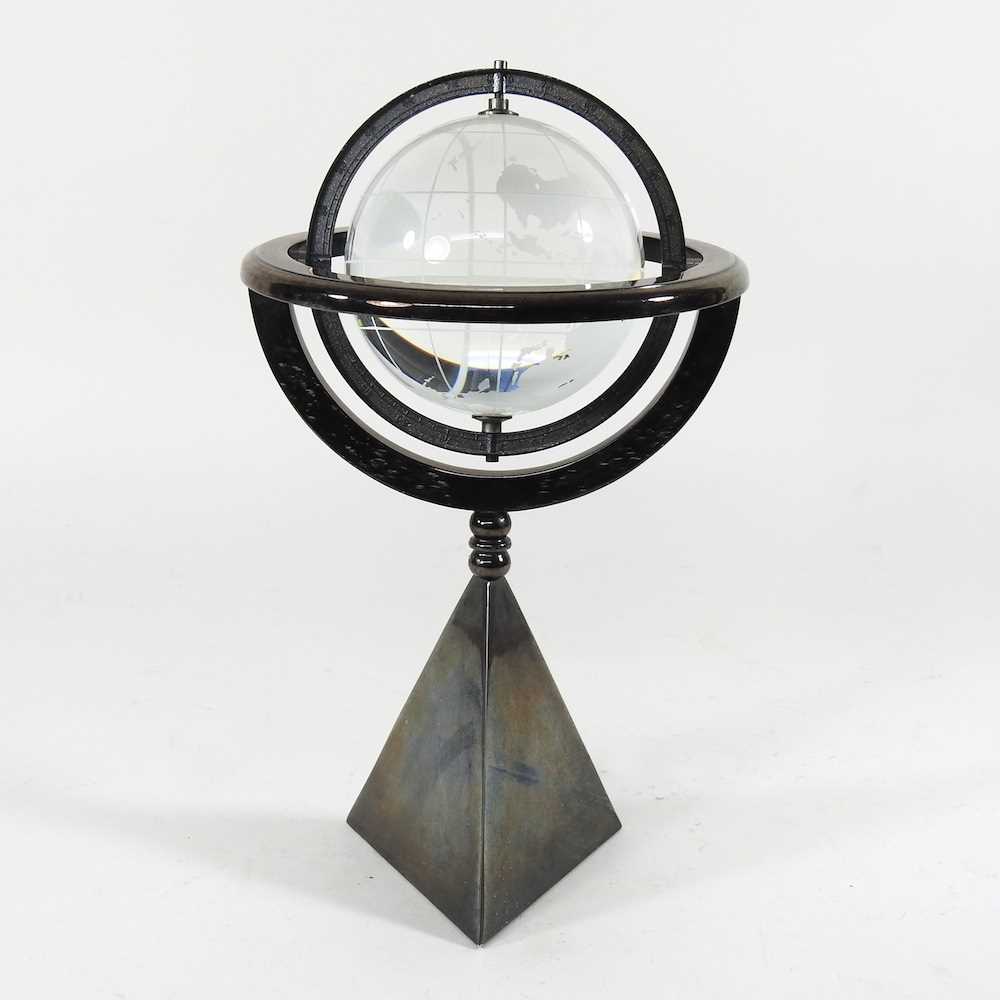 A glass armillary sphere, on a weighted stand, 30cm high