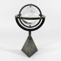 A glass armillary sphere, on a weighted stand, 30cm high