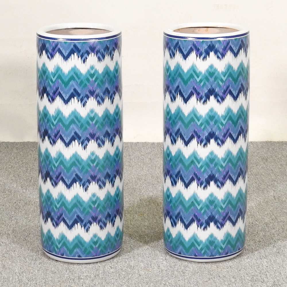 A pair of blue and white stick stands, with zig zag decoration, 60cm high (2)