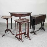 A mahogany half round side table, together with a sutherland table, nest of tables and a tripod