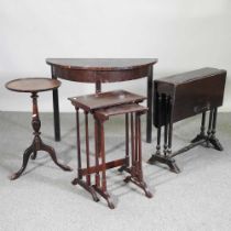 A mahogany half round side table, together with a sutherland table, nest of tables and a tripod