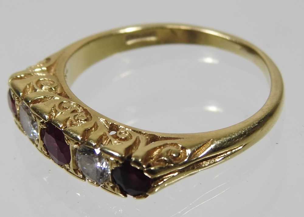 An 18 carat gold ruby and diamond ring, set with five alternating stones, 2.9g, size M, boxed - Image 6 of 7