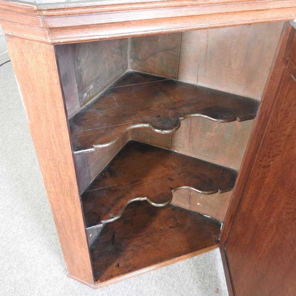 A George III oak hanging corner cabinet, 75cm wide, together with a washstand (2) - Image 2 of 7