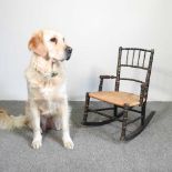 A 19th century child's faux bamboo rocking chair, with a rush seat