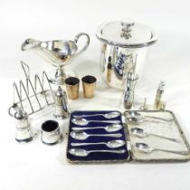 A set of ten silver teaspoons, of golfing interest, together with a Penhaligon's silver perfume