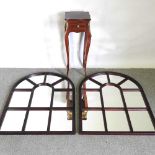 A pair of arched wall mirrors, 104 x 73cm, together with a reproduction side table (3)