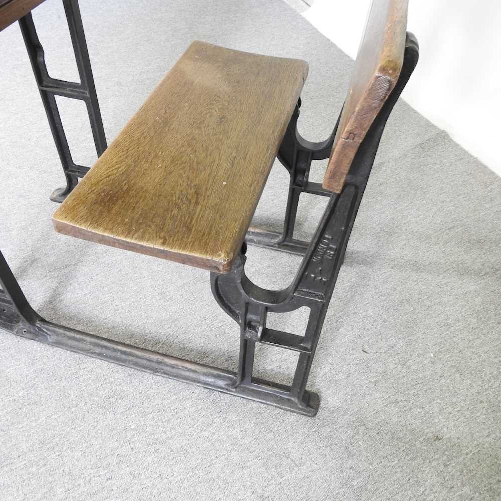 An early 20th century wooden school desk, on an iron frame 61w x 94d x 96h cm - Image 4 of 6