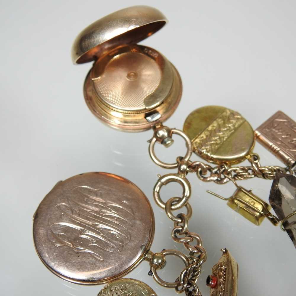 A gold charm bracelet, suspended with twenty-three various novelty charms, to include a sovereign - Image 7 of 12