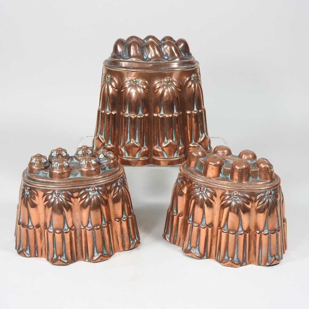 A Victorian copper jelly mould, stamped H. L. & Co, 12cm high, together with another similar and a