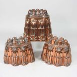A Victorian copper jelly mould, stamped H. L. & Co, 12cm high, together with another similar and a