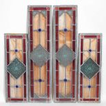 A pair of leaded stained glass windows, together with another smaller (3) 74 x 17cm and 54 x 17cm.