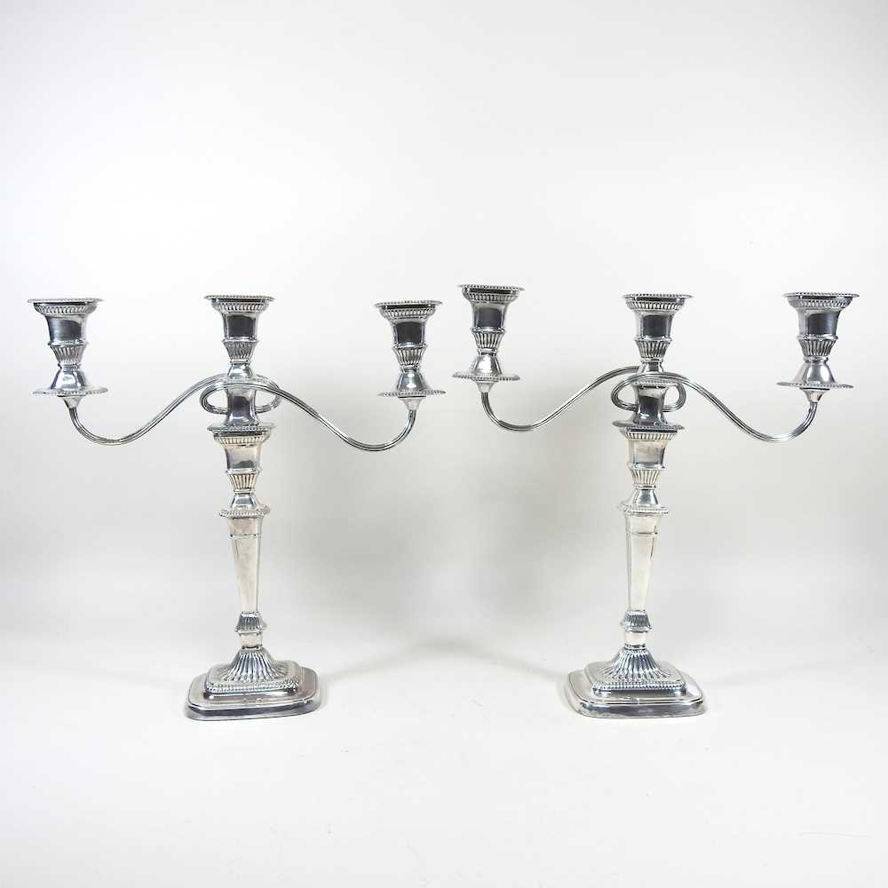 A pair of silver plated twin branch table candelabra, with gadrooned decoration, 38cm high