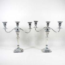 A pair of silver plated twin branch table candelabra, with gadrooned decoration, 38cm high