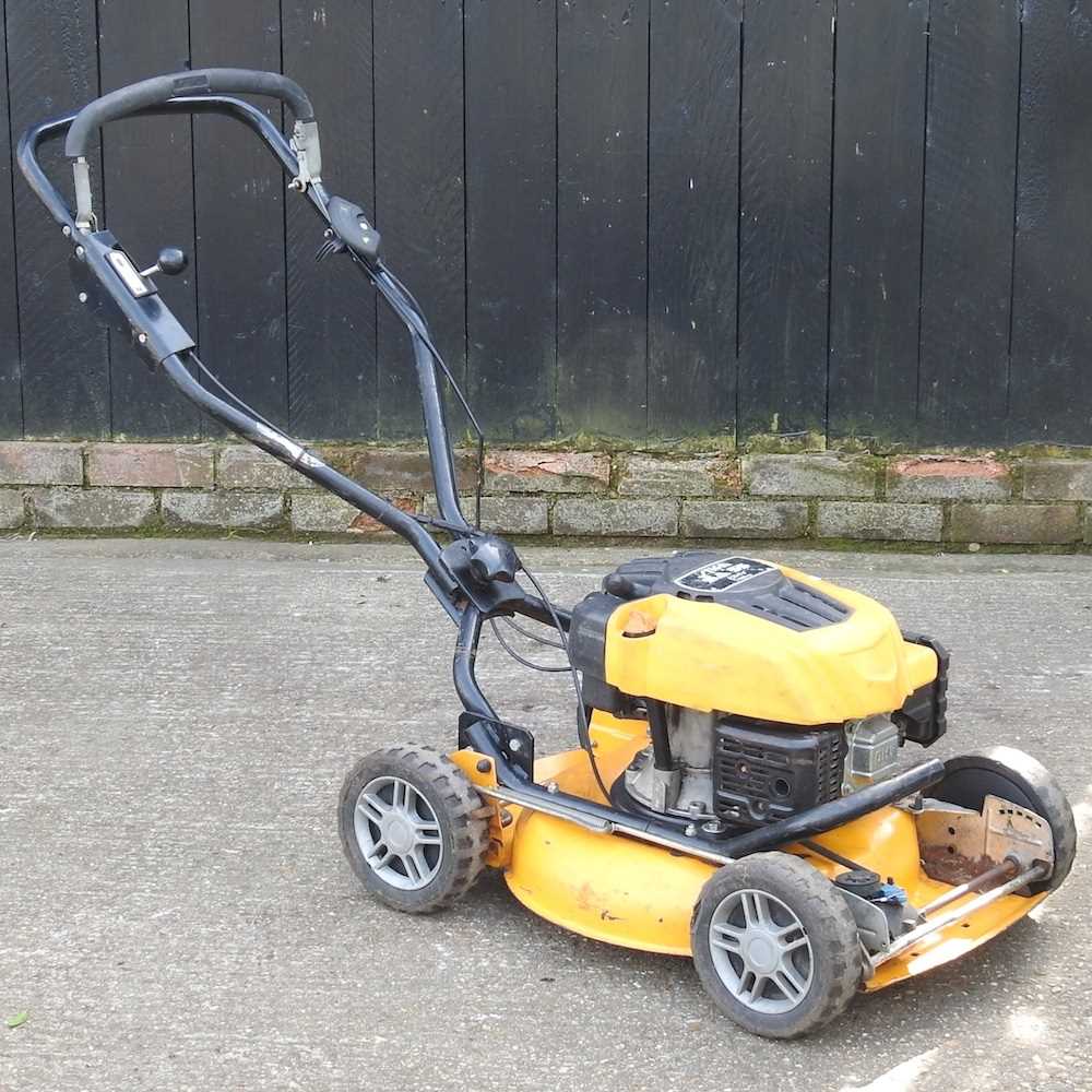 A yellow Stiga SA55 petrol lawnmower