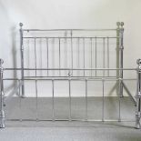 A Victorian style chrome effect Super King size double bedstead, with a slatted wooden base, 194cm