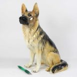 A large Beswick model of a seated alsatian, printed marks, 35cm high