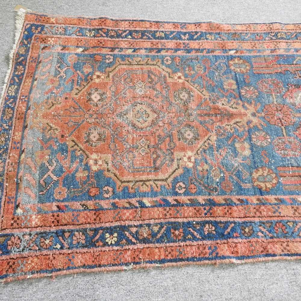 A malayer runner, with flowerhead designs, on a blue ground, 237 x 96cm - Image 5 of 5