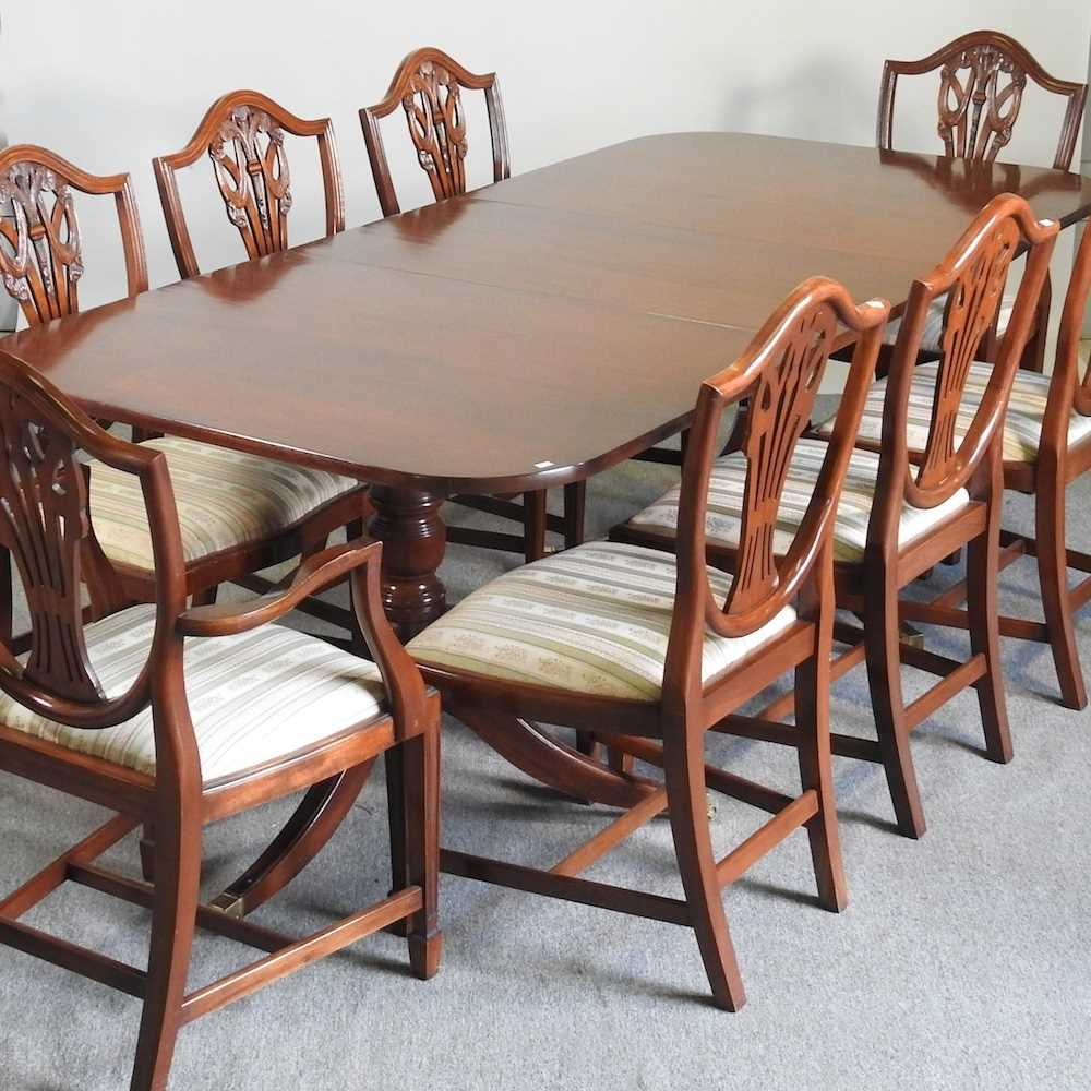 A Mark Elliott twin pillar dining table, with a set of eight dining chairs, to include a pair of