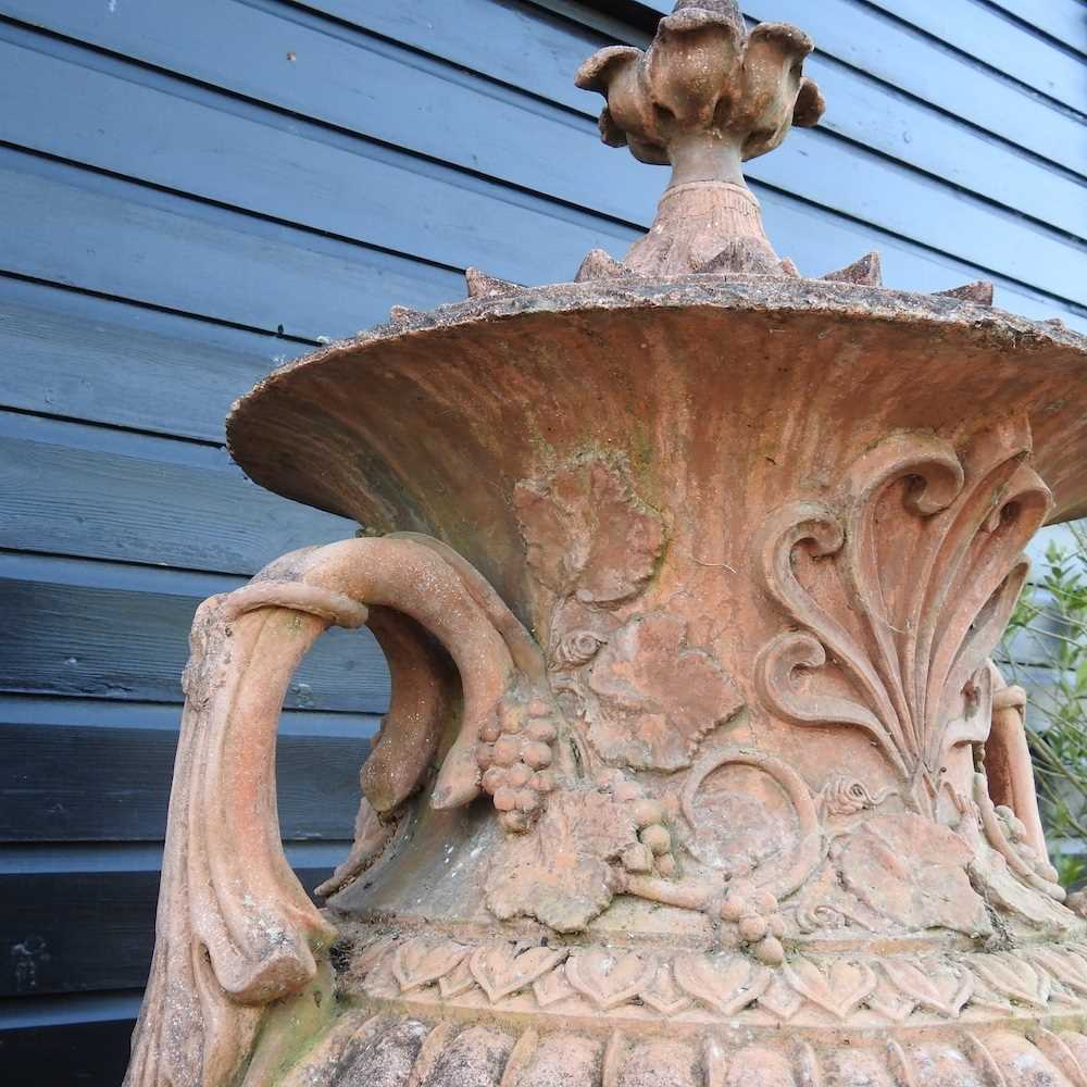 A very large terracotta stone garden urn and cover, of twin handled form, relief decorated with - Image 6 of 7