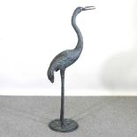 A large metal garden sculpture of a crane, 141cm high Overall condition is complete. Modern cast