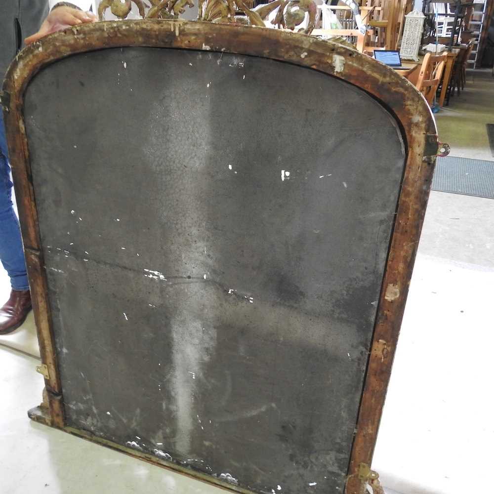 A 19th century gilt framed over mantel mirror, of arched shape, within a moulded surround, - Bild 2 aus 5