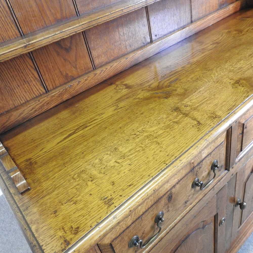 An 18th century style oak dresser, with a boarded back, on bracket feet 143w x 216h x 51d cm - Bild 5 aus 9