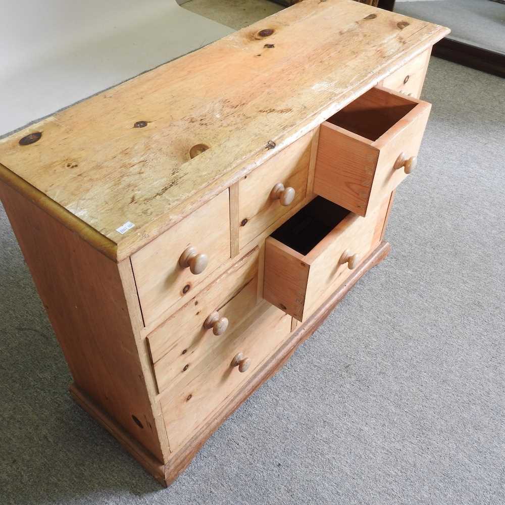 A pine narrow chest of drawers, containing an arrangement of nine short drawers 90w x 33d x 68h cm - Image 3 of 3