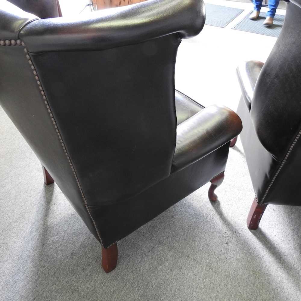 A pair of brown leather upholstered button back wing armchairs, on cabriole legs (2) - Image 5 of 7