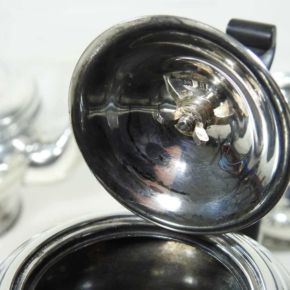 An early 20th century silver four piece tea service, of circular shape, with ebonised handles and - Image 8 of 8