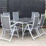 A modern garden table and a set of six matching folding armchairs (7) 180w x 110d x 74h cm