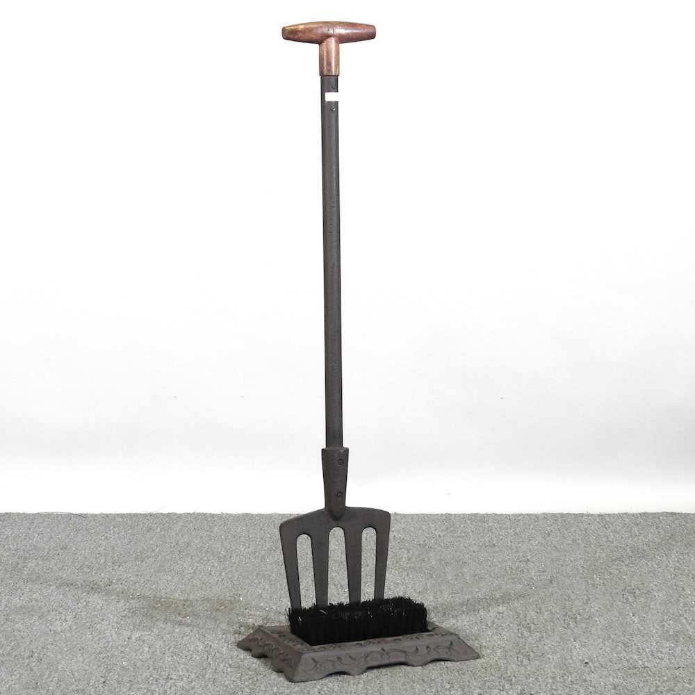 A boot scraper and brush, with a long handle, 90cm high