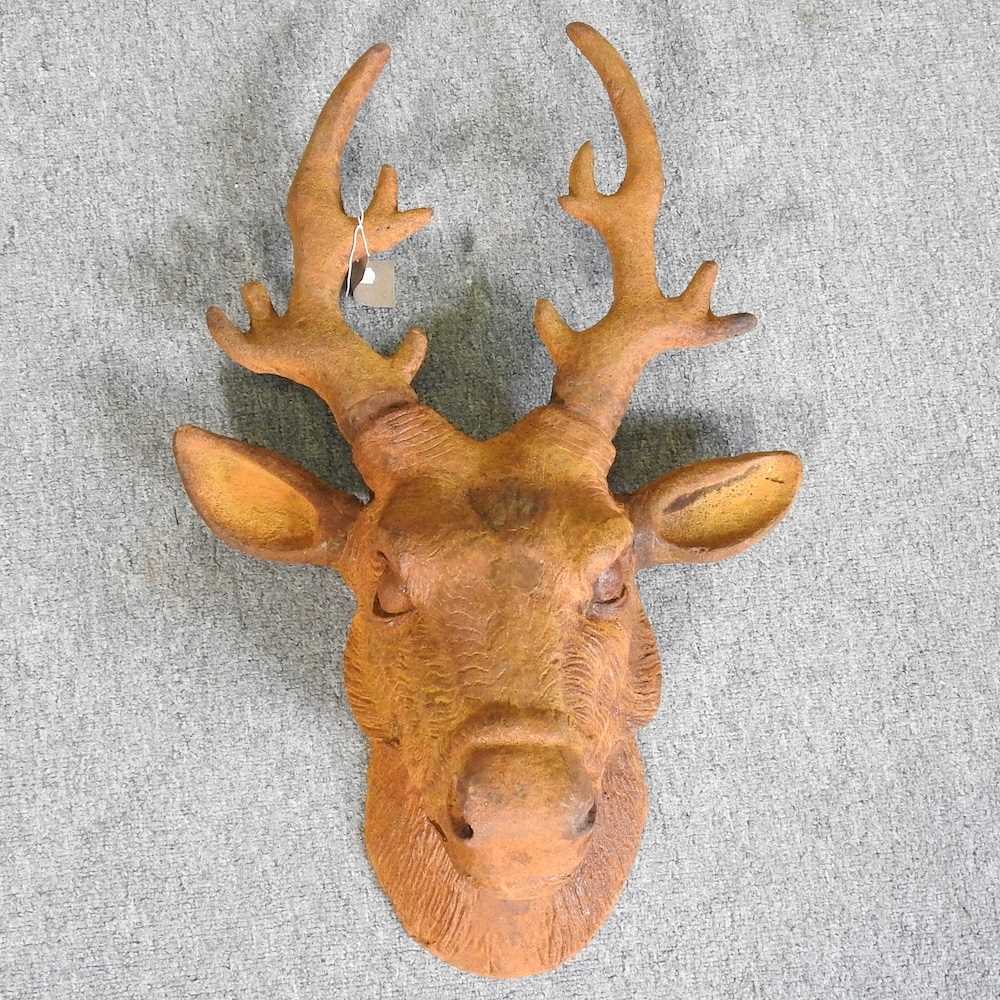 A large rusted model of a deer head, 62cm high 40w x 60h cm