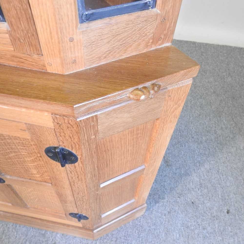 Robert 'Mouseman' Thompson, of Kilburn, a light oak standing corner cabinet, enclosed by a lead - Image 2 of 7