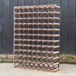 A large metal and wooden wine rack 83w x 23d x 103h cm
